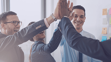 People happily high-fiving each other